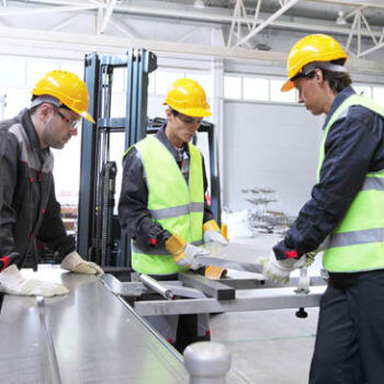 Men looking at plans in hard hats