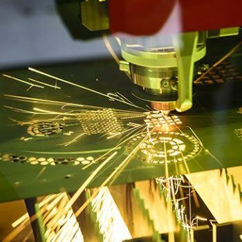 Nested machine cutting with sparks flying