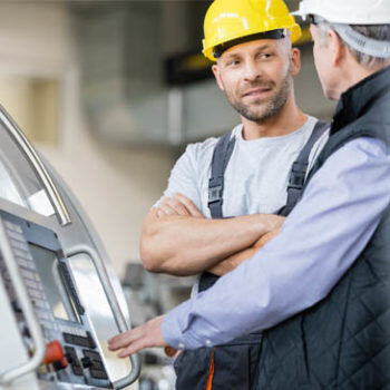 Man looking at person in hardhat