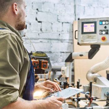 Man looking at machine computer