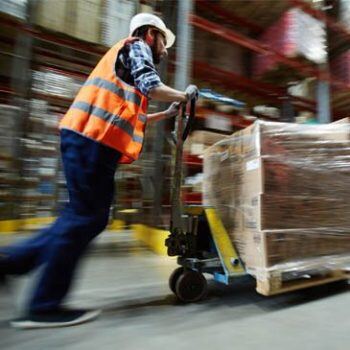 Man pushing product around the shop floor