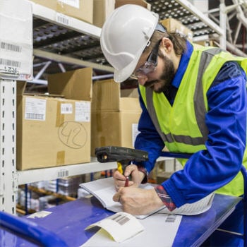 Man in hard hat writing