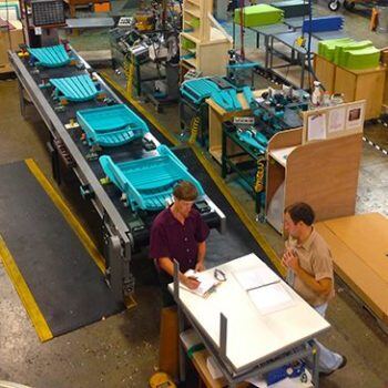 Man on manufacturing line from above