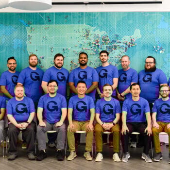 Groupe of men all dressed in the same blue shirt