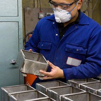 Man in mask looking at product