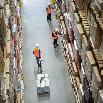 Men in warehouse from above