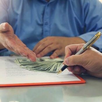 Hands with pile of money