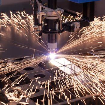 Machine cutting with sparks flying