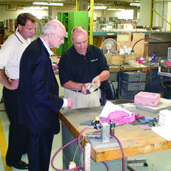 Men looking at part