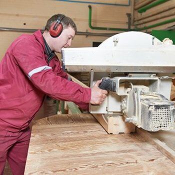 Man working on wood part