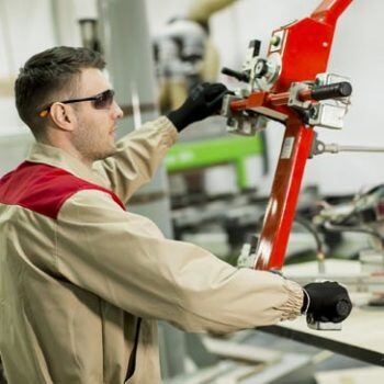 Man working on manufacturing machine