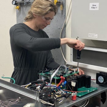 Woman working on circuit board