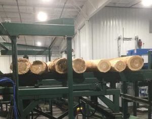 lumber on conveyor in furniture manufacturing plant