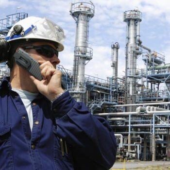 Man on phone at oil and gas facility