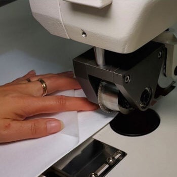 Woman's hand working on a machine