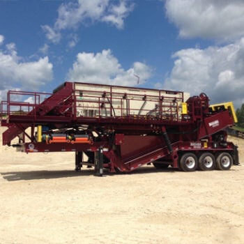 Large manufactured truck outside on sand