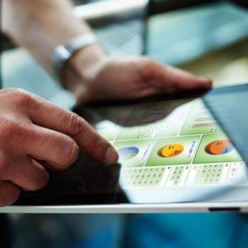hands on iPad with ERP software