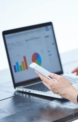 Woman checking KPIs on laptop