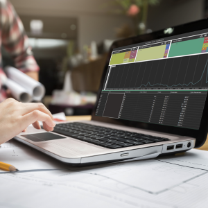 Engineers using the Purchase Order Dashboard on laptop computer