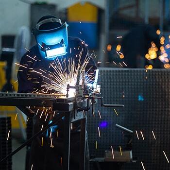 man welding with sparks