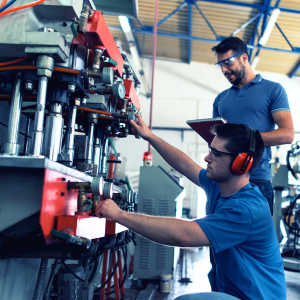 Two men working on a machine