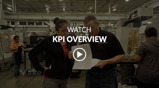 Manufacturing shop floor with a video play button on top